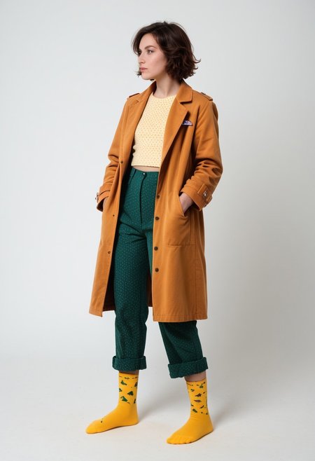 (realistic photograph of woman), 1girl, solo, simple_background, white_background, scksnsndls, patterned red and yellow socks, green trousers, orange and brown coat, short_hair, looking_away, full_body, (birksonsocks, birkenstock)