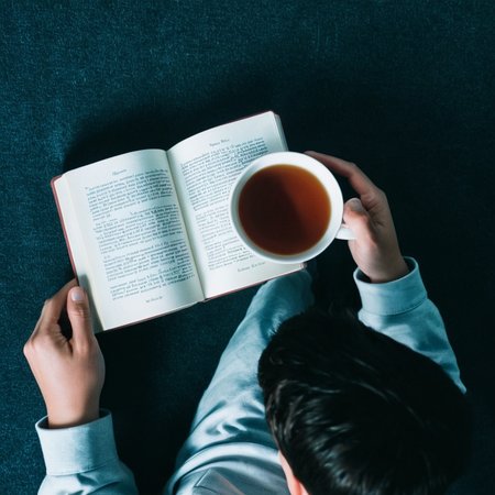 <lora:add-detail-xl:1>
<lora:detailed:0.3>
<lora:perfection style:0.3>
<lora:xl_more_art-full_v1:0.3>
 <lora:Donnie Darko film style:1>
From above, a person holding a cup next to a book,1boy,holding,english text,cup,copyright name,pov,out of frame,tea , cinematic, film, Donnie Darko film style