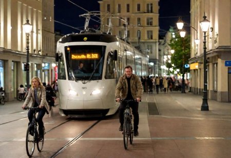 Raw photo,( shallow depth of image:1.2), (minimalistic:1.4), outdoors, wide shot of the downtown of Helsinki, tram, bike riders, night, black bullet train, 38 mm photograph, professional, FOV, HDR, natural lighting, motion blur, lowfi, KodakPhotoMaybe, photo in phst artstyle