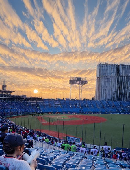 (1girl:1.5), (general:1.3), (detailed background:1.5), baseball jersey, (white jersey, red pinstripe pattern:1.1), dark blue baseball cap, dark blue undershirt, holding megaphone, happy, evening, BREAK
<lora:jingu_stadium:1> jingu stadium, outfield seats, stands, baseballfield, scenery, outdoors, audience, crowd, people, multiple boys, multiple girls, day, sunset, night, cloud, cloudy sky, sky, building, city, cityscape, skyscraper, sign, sun, blue sky, seats, BREAK
dramatic shadows, cinematic lighting, (photo background:1.1), (8K resolution:1.2), (masterpiece:1.2), best quality, amazing quality, very aesthetic, absurdres, newest, (ultra detailed:1.3), (uhd:1.1), <lora:cfg_scale_boost:0.7> <lora:Smooth_Booster_v2:0.5> <lora:StS-Illustrious-Detail-Slider-v1.0:3.0> BREAK