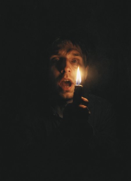 horror, shines a lighter on himself from below, Face lighting from below, bottom view, lighter in hands, 8k,   <lora:- SDXL - vant_blk_contrast_V2.0:0.7>   <lora:Desolation:0.5>