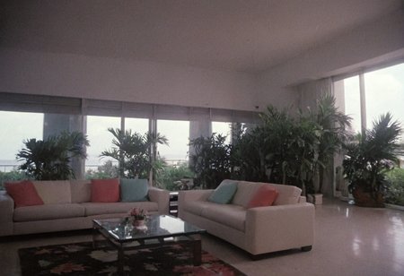 analog film photo MiamiVice, indoors . faded film, desaturated, 35mm photo, grainy, vignette, vintage, Kodachrome, Lomography, stained, highly detailed, found footage