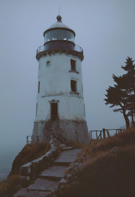 soaked_mundwasser_pee, In a grainy, handheld video, a lone explorer investigates an old, decrepit lighthouse on a foggy night. As he ascends the spiral staircase, strange whispers and ghostly moans fill the air. At the top, he encounters a monstrous, ethereal being with tentacles and multiple glowing eyes. The footage is chaotic and filled with static, capturing the explorer's terror and the creature's unearthly presence.