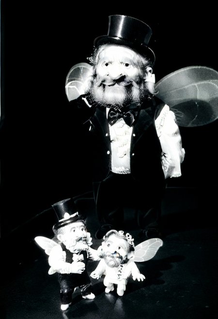 (((black and white, monochrome, greyscale, powerbeard, long beard, huge beard, very long beard))),((fairy, wings, highpixiedsrk, fully clothed, small man with mustache, top hat, kenbis, chibi, chibi, male only, dancing, male, male chibi, monocle, art deco, thick mustache, comically large mustache, handlebar mustache, tiny, multiple men, shrunk, microxl, some little guys, 2 men, high angle, from above)), bwMovies, realistic, photo, vintage photo, ((very small man, small man, a small man, a man who is small, a small man)) suit, an unapologetically small human male, black and white, smiling, very happy, euphoric, ecstatic, wonderful small men, large smile, huge smile, muscular, muscles, indoors, cinema, movie theater, detailed background