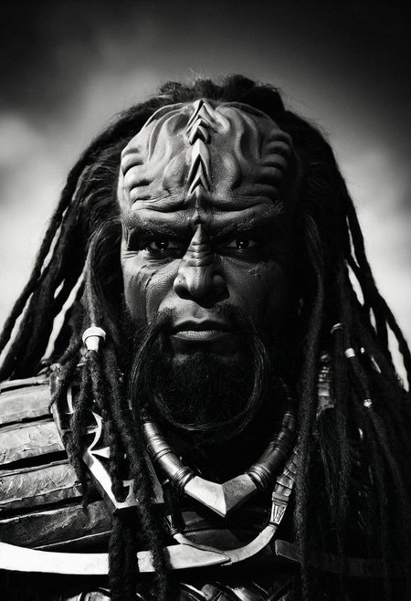Monochrome portrait photography, extreme close-up, male klingon, strong brow ridges, dark brown skin, proud expression, ornate forehead crest, ritual markings, traditional klingon jewelry, warrior dreadlocks, sharp features, intense eyes, deep shadows, single light source from the side, intense gaze, high contrast, Hasselblad 500C/M with 80mm lens, Ilford Pan F Plus 50, dramatic lighting, cinematic, 8k --ar 2:3 --style raw