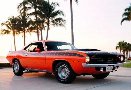 ClassicMuscleCar, gleaming Plymouth Barracuda, side view, scenic seaside cityscape sunset, palm trees, 4K, highly detailed, (((stylish grainy analog 35mm film photo)))
