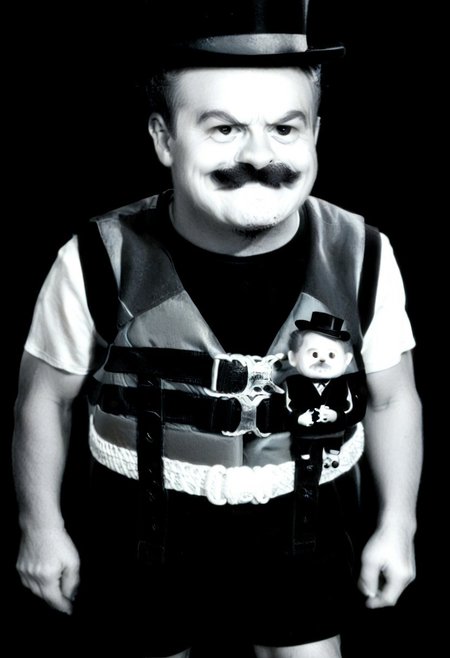 ((((((black and white,black shirt, belt, stubble, red theme, shorts, greyscale, 1boy, life vest)))))),((small man with mustache, top hat, kenbis, chibi, chibi, male only, male, male chibi, monocle, art deco, thick mustache, comically large mustache, handlebar mustache, tiny, multiple men, shrunk, microxl, some little guys,  high angle, from above)), bwMovies, realistic, photo, vintage photo, ((very small man, small man, a small man, a man who is small, a small man)), an unapologetically small human male, black and white, smiling, very happy, euphoric, ecstatic, wonderful small men, large smile, huge smile
