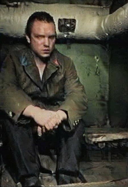 score_9, score_8_up, score_7_up,
solo, photo real, masterpiece,
absurdes, ultra detailed, amazing quality,
detailed eyes, perfect hands, detailed fingers, photography, film grains, grainy, zlnyslnk,
detailed face, detailed eyes,
looking at viewer,
underground, basement, (green walls), pipes, indoors, 
unique angle, dramatic angle, brown military jacket,
muscular, sitting, playing checkers,
zlnyslnk, brtshk, short black hair, shaved face, black military jacket