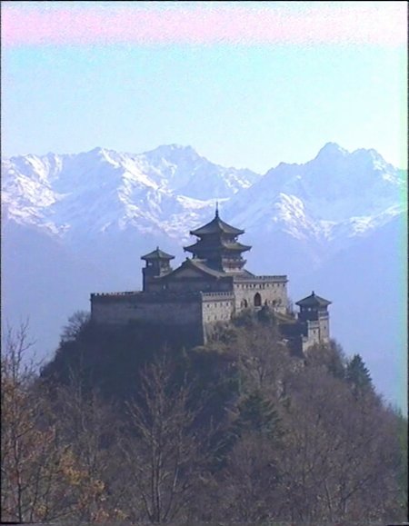 <lora:2000analogcore_v3:1>,A fortified japanese temple  on the peak of a moutain, surrounded by snowy mountains,muted color tones,horizontal scan lines,grainy texture,muted color palette,vintage VHS camcorder aesthetic,âââ