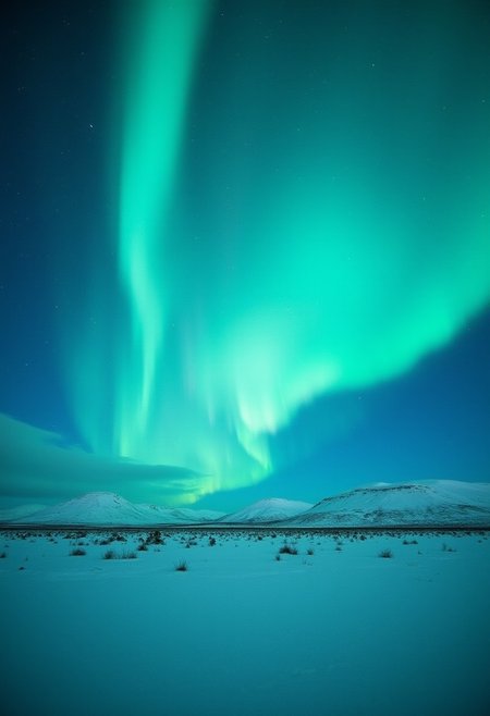 A breathtaking view of the Northern Lights shimmering over a snowy Icelandic landscape,