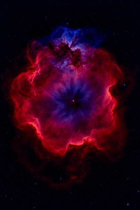 <lora:Vibrant_Nebula_2:0.8> VibrantNebula style.
The image is a high-resolution photograph of a nebula, specifically the Carina Nebula, captured in space. The nebula appears as a vast, swirling cloud of interstellar gas and dust, with colors that range from deep reds, purples, and blues. The central region is dominated by a bright, swirling red cloud, which transitions into a deep blue area around the edges.  The red portions resemble a swirling, turbulent sea of clouds, with some areas appearing denser and darker, indicating more concentrated gas and dust. The blue regions, on the other hand, are less dense and more transparent, allowing more stars to shine through. Scattered throughout the nebula are numerous stars, some of which are bright and visible, while others are dimmer.