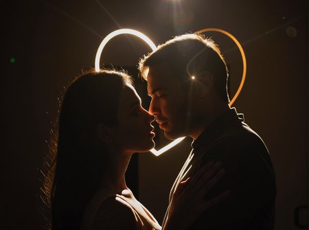 (strong rim backlight, only edge outline), strong bright love shape outline light, it resembles love hart,  strong shadow, desi Indian woman and man trusting each other, eyes wide open, look each other eyes,  intense emotion, trustworthy, creative art, glow, bloom,  simple soft expression, fully clothed, strong dark shadow, eyes wide open, forehead touching each other, holding faces, dark foreground, ((strong huge love symbol outline mark, love symbol shape lens flare))