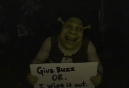 An omegle.com webcam taken at night of Shrek in a swamp smiling a very wide, creepy, and extremely uncanny smile. It is dark. Holding a sign that says "Give Buzz or I wipe it out" <lora:lora09.TA_trained:1>