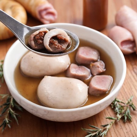 For a realistic style image of a spoon with some food in it,<lora:Tang_yuan:0.85>,Ham roast turkey steak filling ,