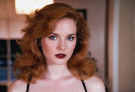 MiamiVice analog photo ginger woman indoors, blue eyes, glossy dark lipstick, ((soft focus, depth of field, film grain, masterpiece, looking at viewer)) <lora:MiamiVicev2-XL:0.4> <lora:EuroBabe-v4-XL:0.6>