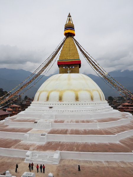 <lora:Boudhanath_Stupa:0.6> boudhanathstupa,build on the top of a mountain,  drone photo